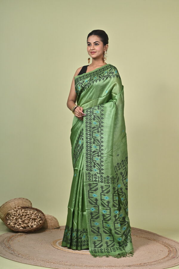 Bonolota green Tussar Jamdani saree with charcoal geometric motifs